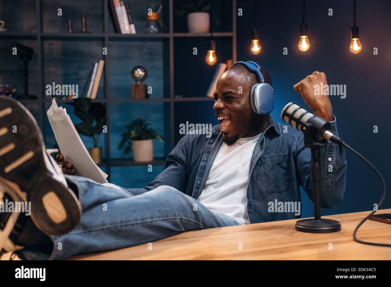 Black man is doing podcast in the studio. Stock Photo