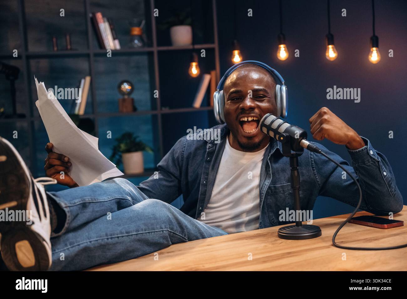 Black man is doing podcast in the studio. Stock Photo
