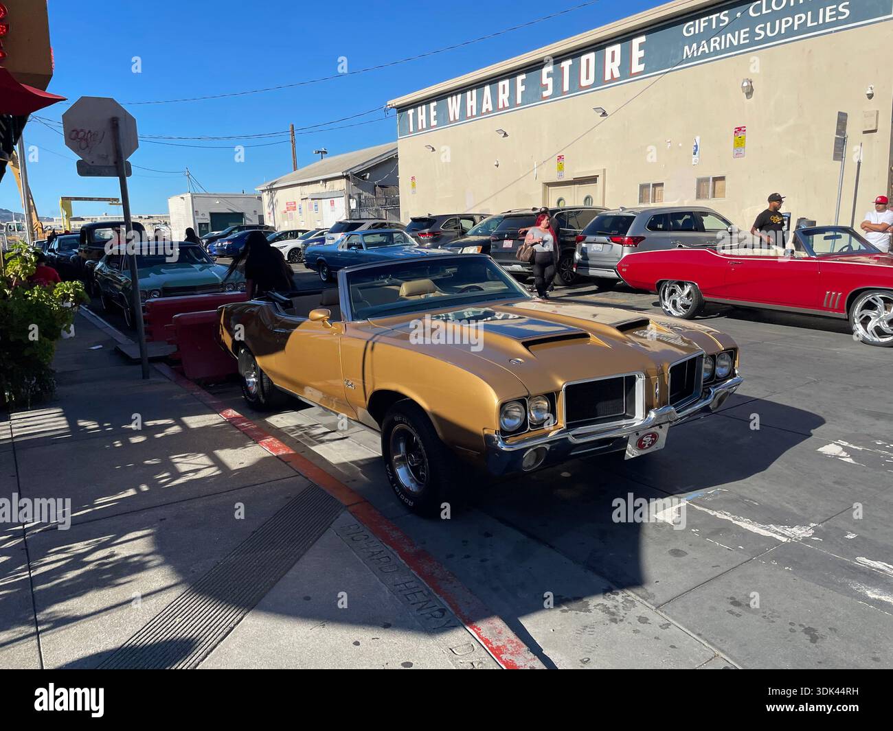 Classic muscle cars parked outside The Wharf Store near Fisherman’s Wharf, San Francisco, California, USA. - Smartphone Captured Stock Image