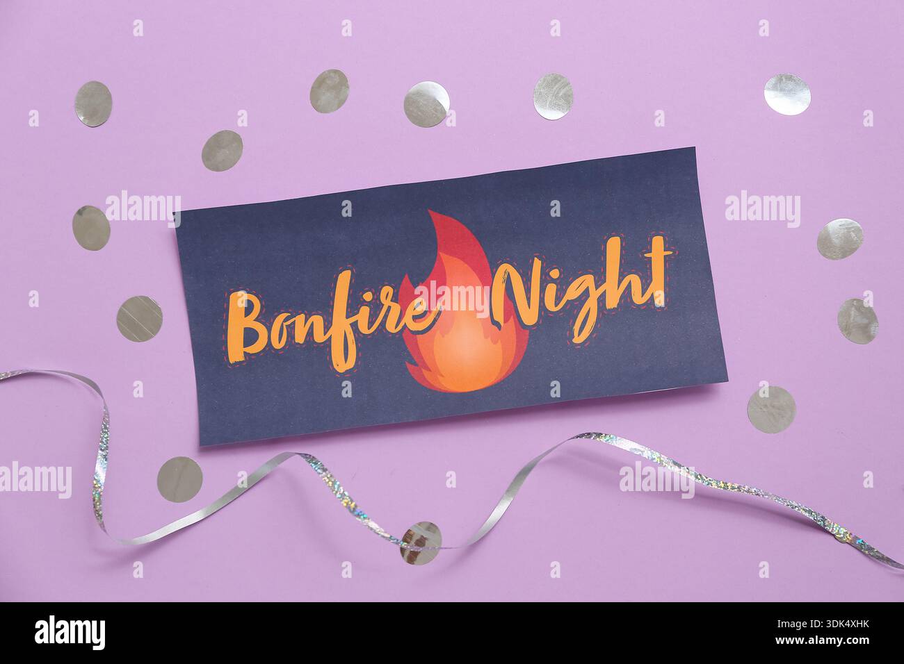 Greeting card for Guy Fawkes night with confetti and ribbon on purple ...