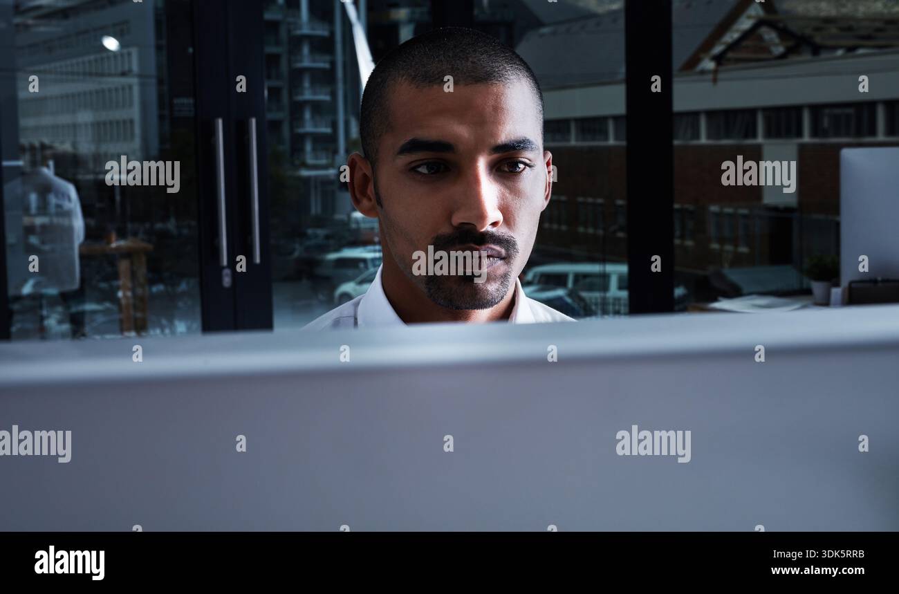 Night, man and software developer in office with computer, AI and cloud computing for cybersecurity. Dark, person and coding in workplace with desktop Stock Photo