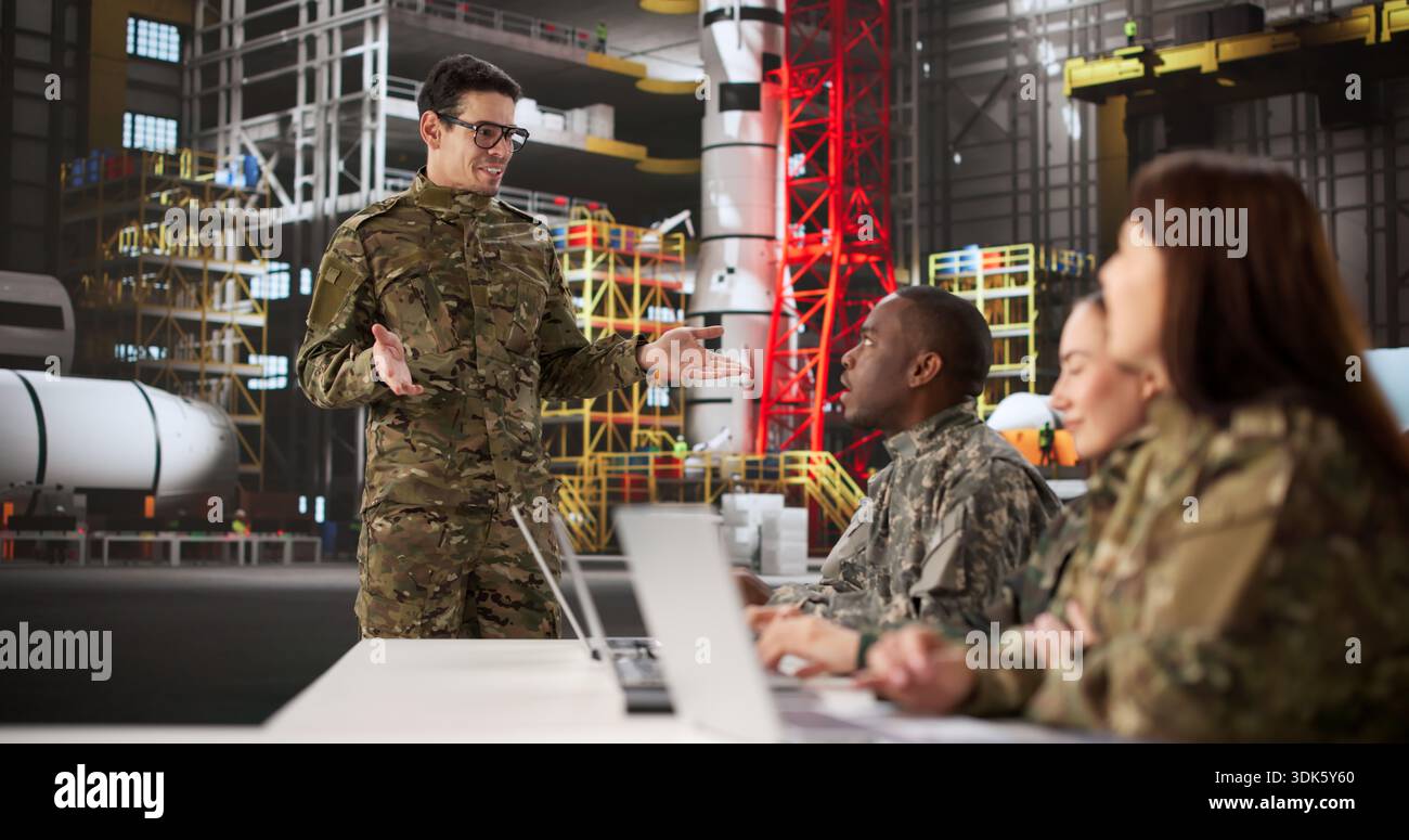 Young Aerospace Engineer Giving Presentation On Rocket Construction Techniques To Team Stock Photo