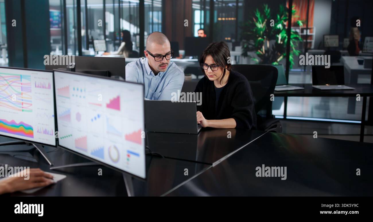Business Analyst Team Is Analyzing High Performance Data On Multiple Computers Stock Photo