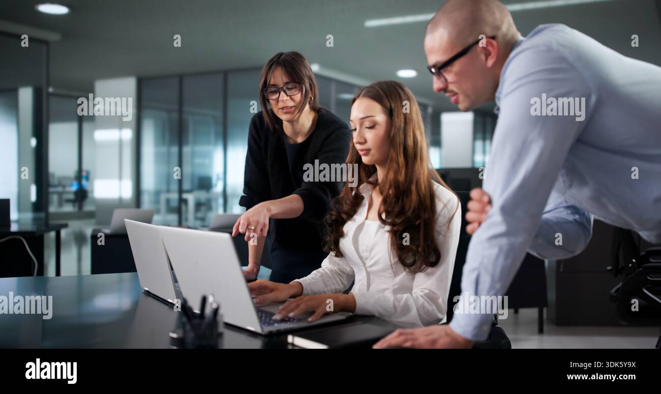 Intense Coding Session: Diverse Team Of Programmers Develop Software Programs. Cipher Fraud: Accountant Stock Photo