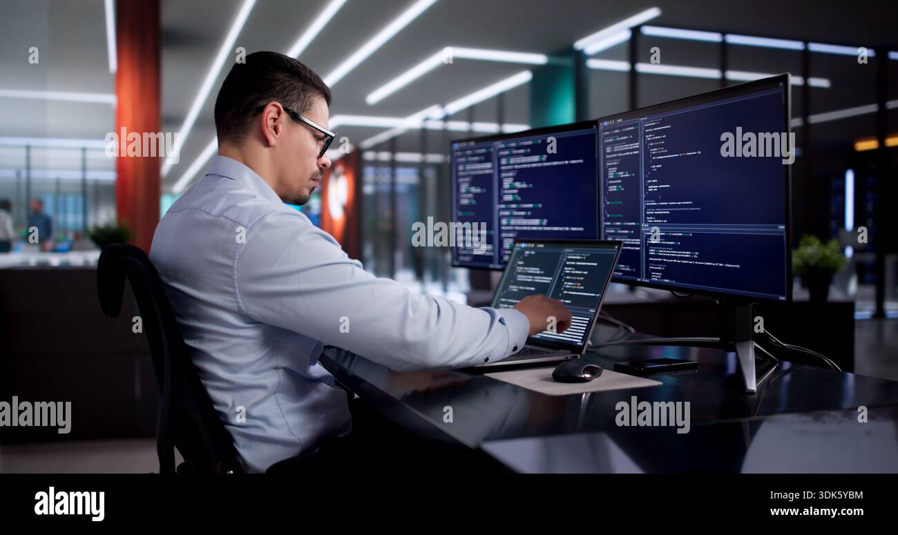 Busy Software Engineer Coding In Office, Developing Web Applications For Company. Stock Photo