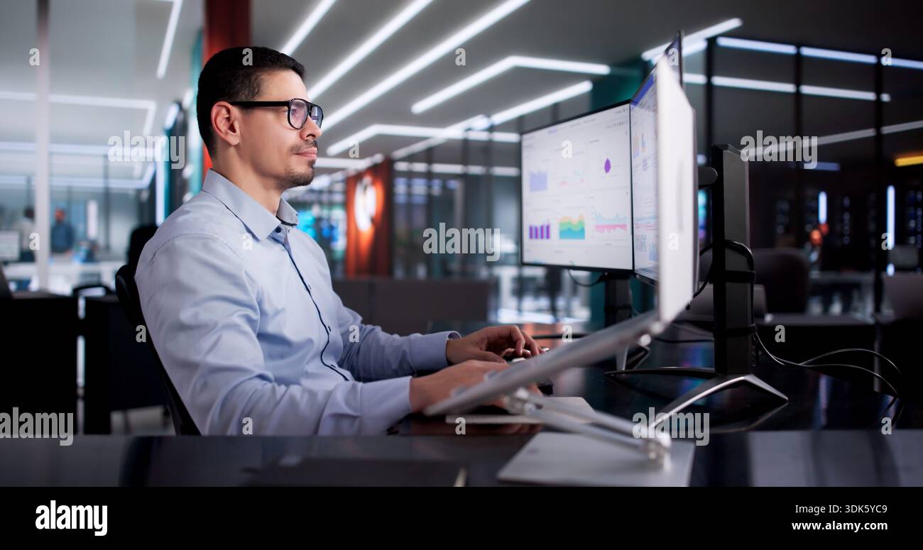 Data Analyst Analyzing Multiple Dashboards, Advising Manager In Business Office. Stock Photo