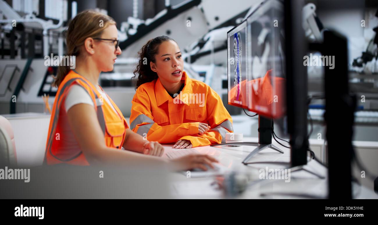 Women Engineers Developing Automobile Gearbox Using 3D CAD Software Stock Photo