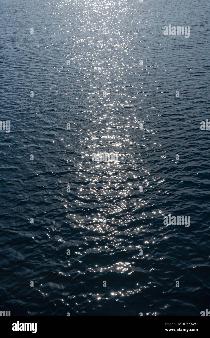Sparkling blue sea surface. Abstract background. Stock Photo