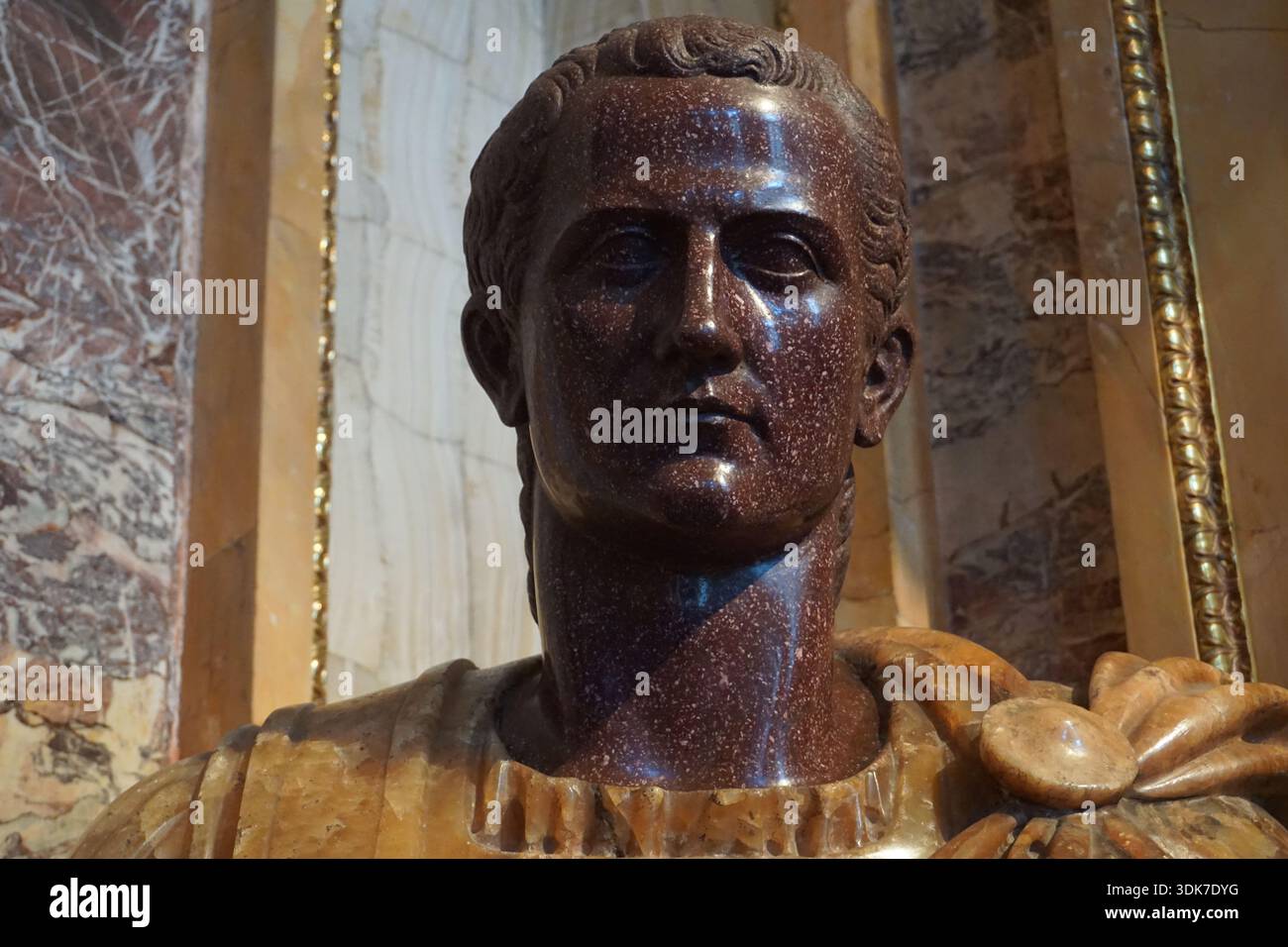 Close up portrait of a marble bust or statue of ancient Roman emperor ...