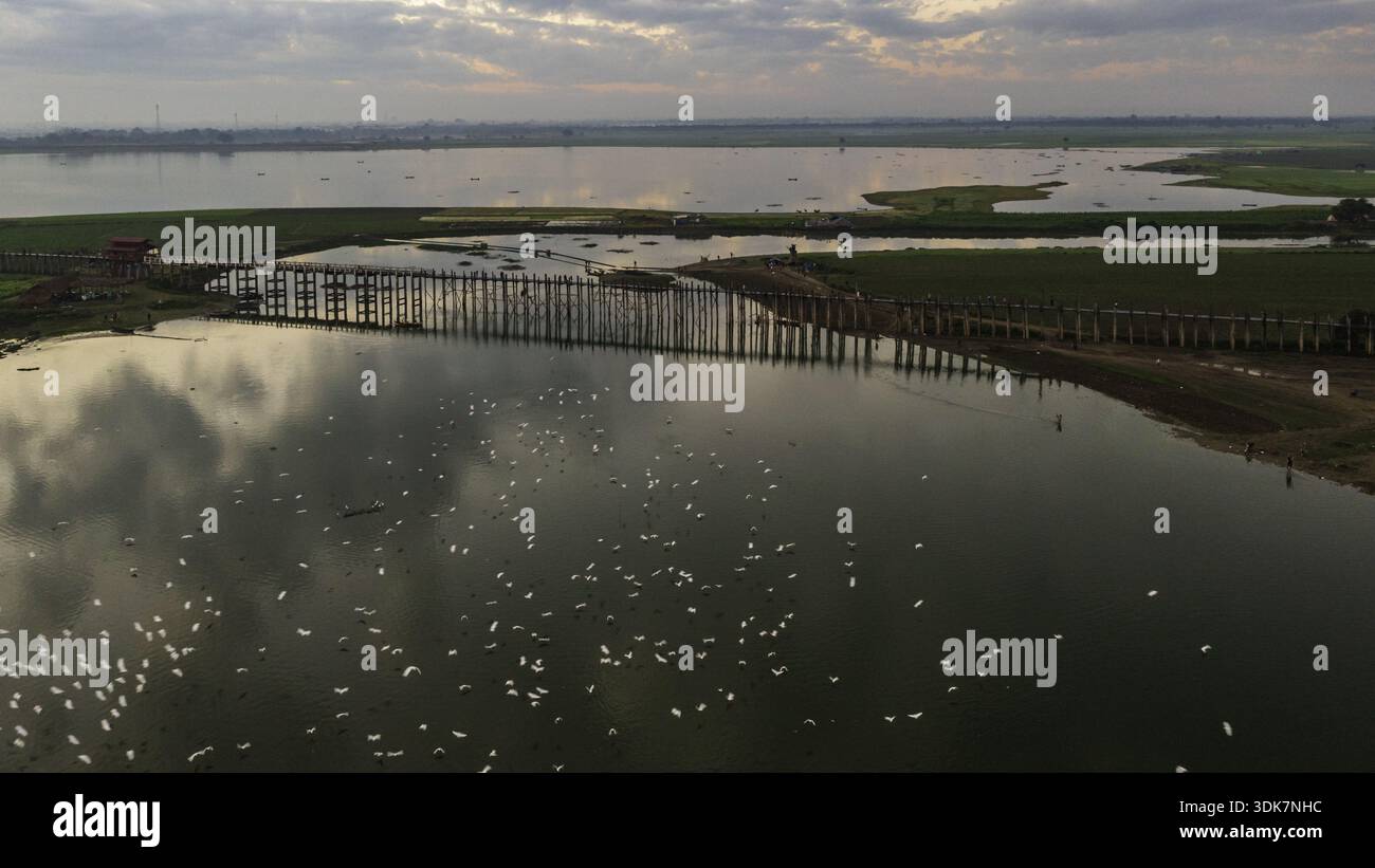 Aerial view of U Bein Bridge stretching across the tranquil Taungthaman ...