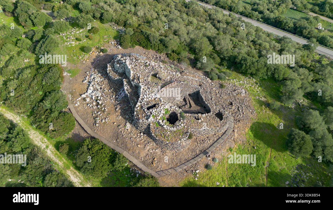 Aerial view of an ancient nuraghe stone structure, prehistoric ruins ...