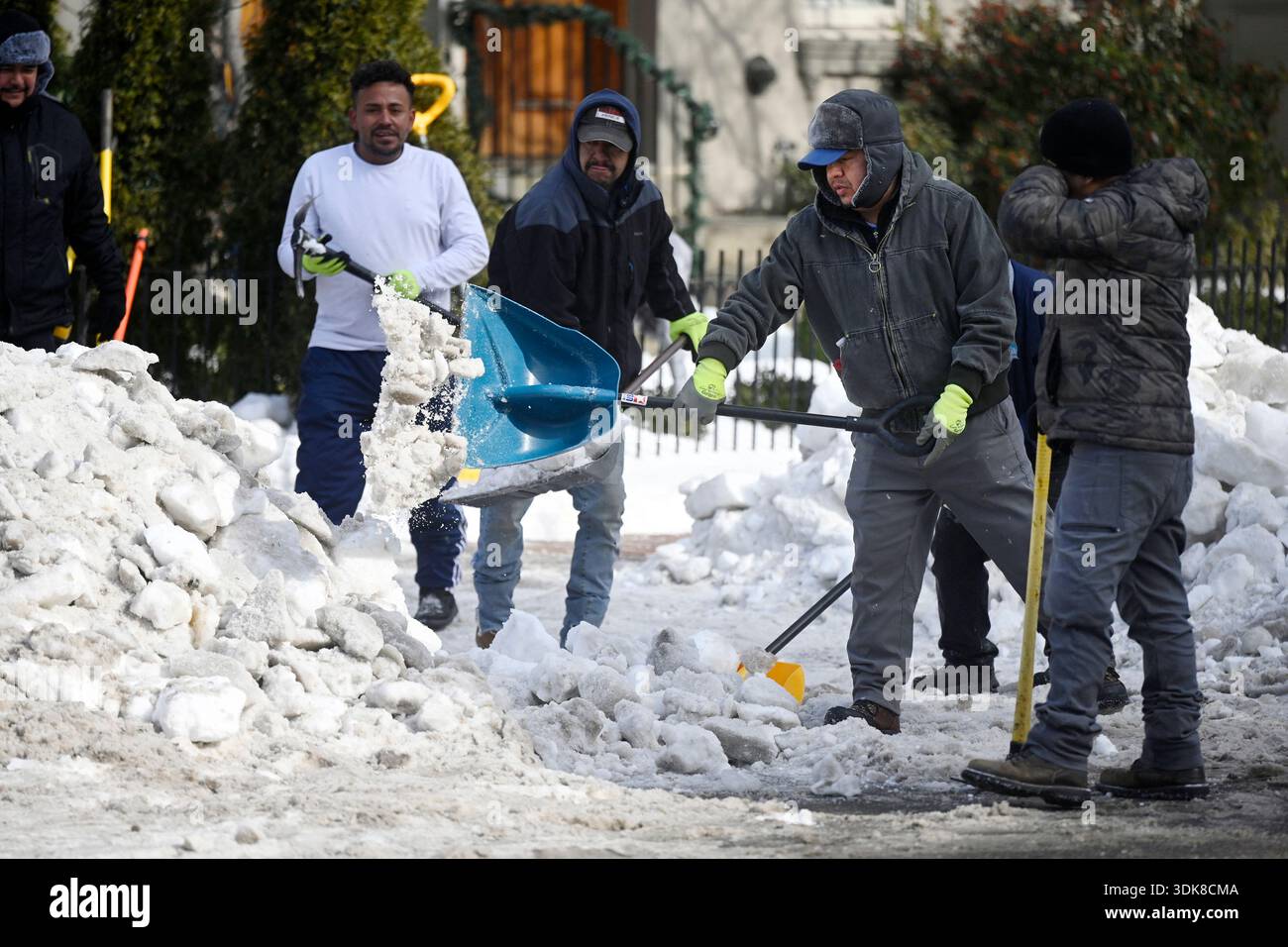 People remove snow left from the weekend snowstorm on January 30, 2026 ...