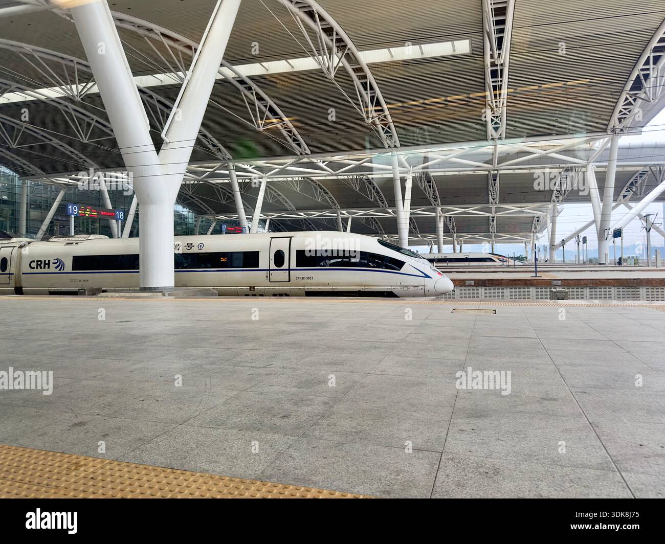 Guangzhou, China - Jan 28, 2024: Chinese CRH high speed train at Guangzhou railway station. - Smartphone Captured Stock Image