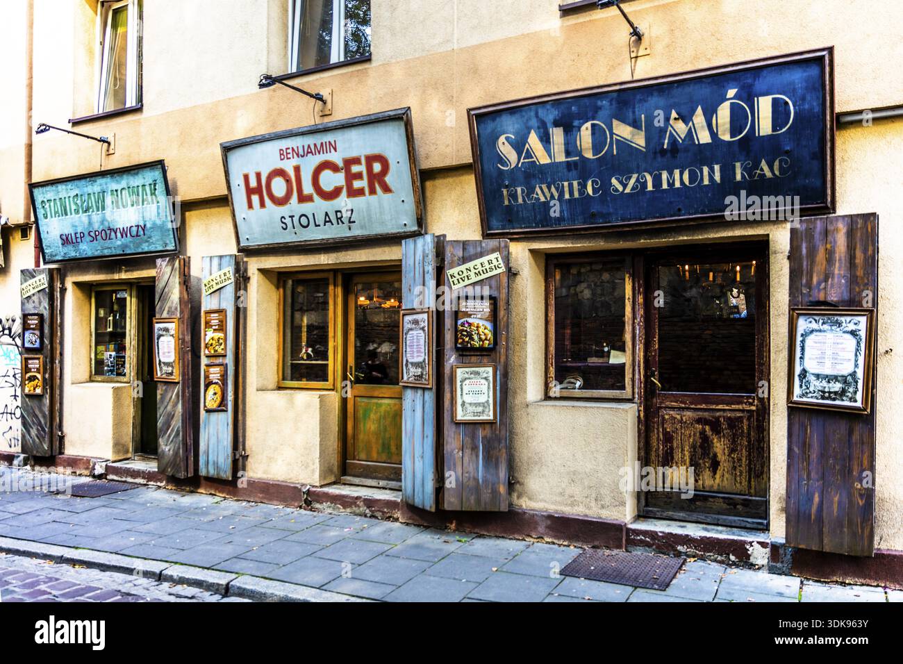 Shop fronts on Szeroka Street, signs bearing Polish and Jewish names, Kazimierz, a historically significant, formerly independent district that has de Stock Photo