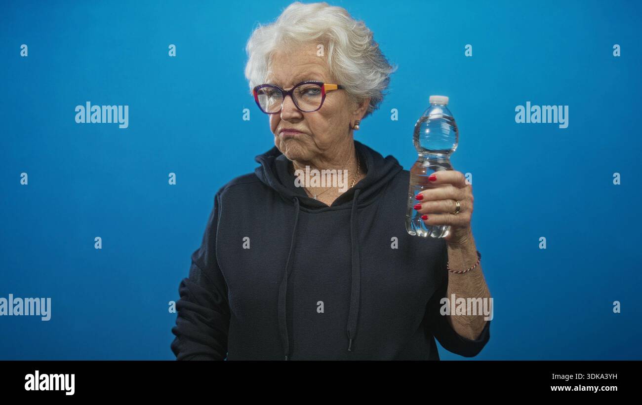 Elderly woman in hoodie holding hi-res stock photography and images - Alamy