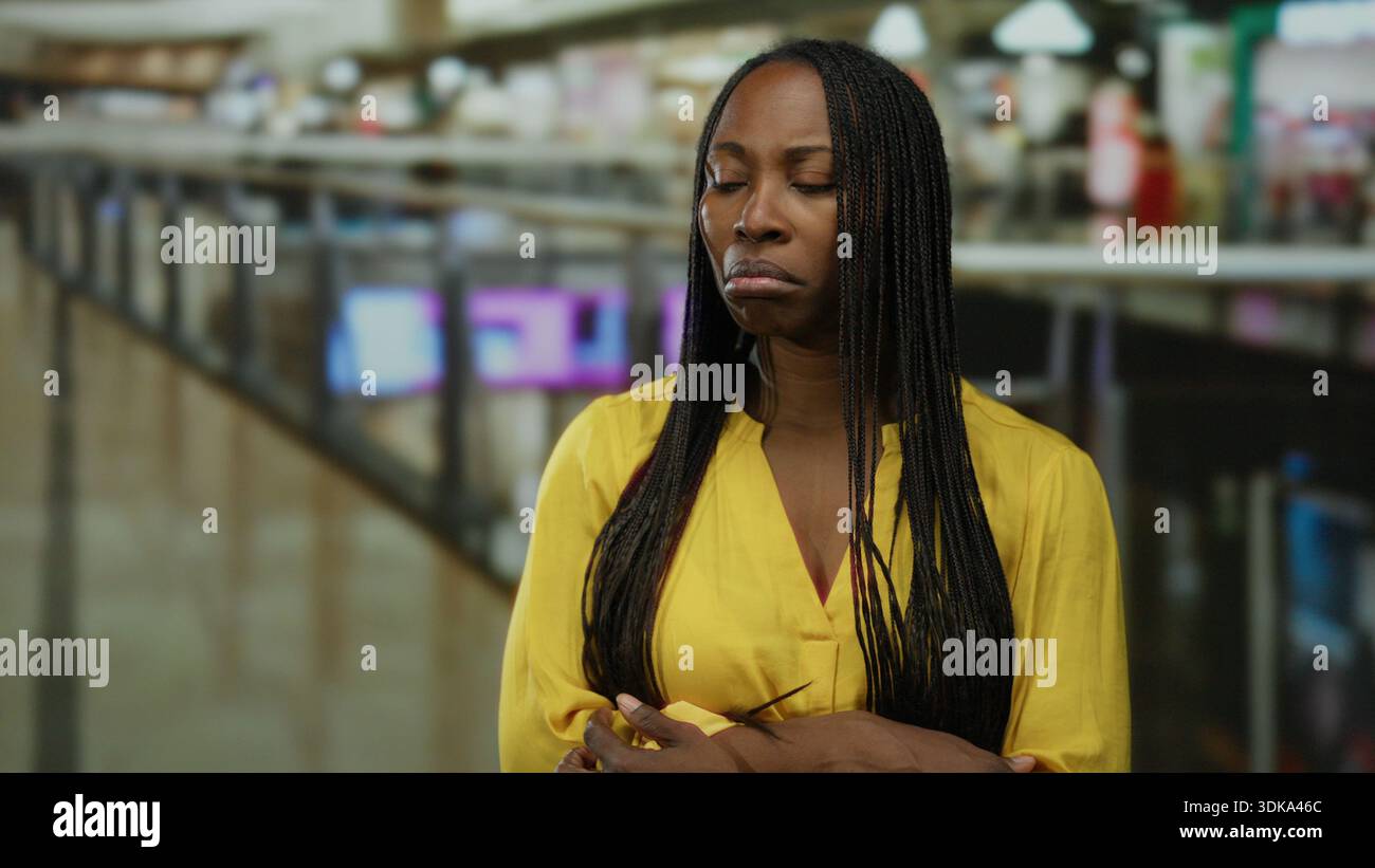 Woman braids stands in mall hi-res stock photography and images - Alamy