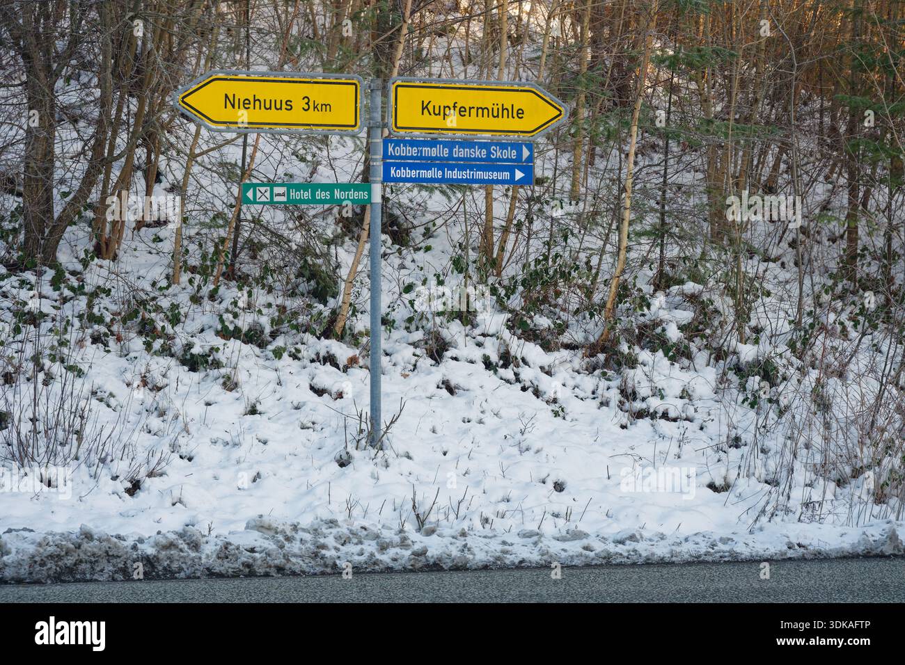 Snow covered road direction signs after winter storm Elli on January 9 ...