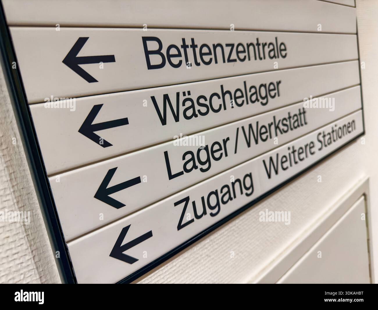 Ward. Sign German Hospital wayfinding sign with directional arrows guiding to ...