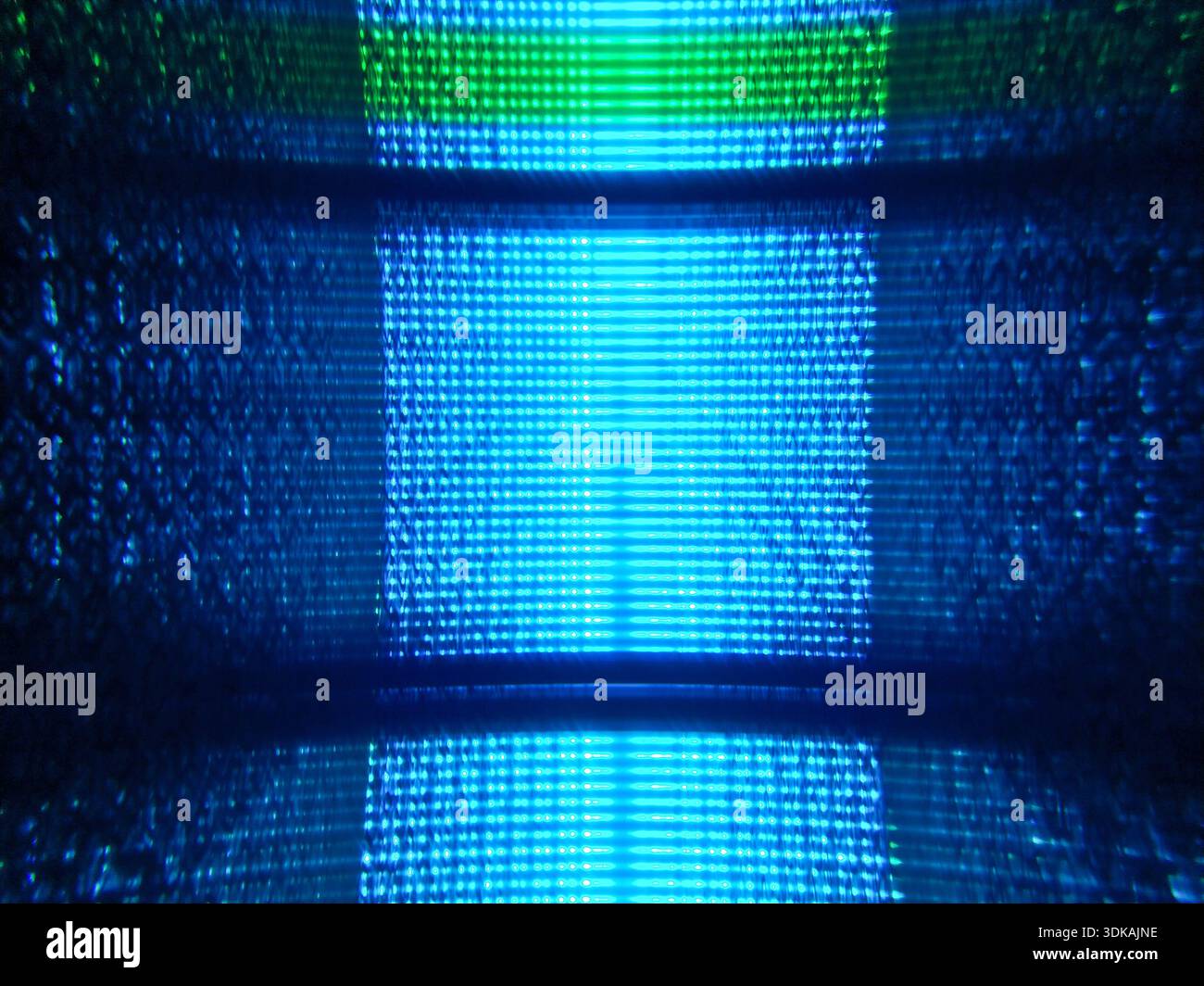 Abstract background texture of glowing blue digital lines and pixels creating a futuristic high-tech data matrix atmosphere in the dark. Stock Photo