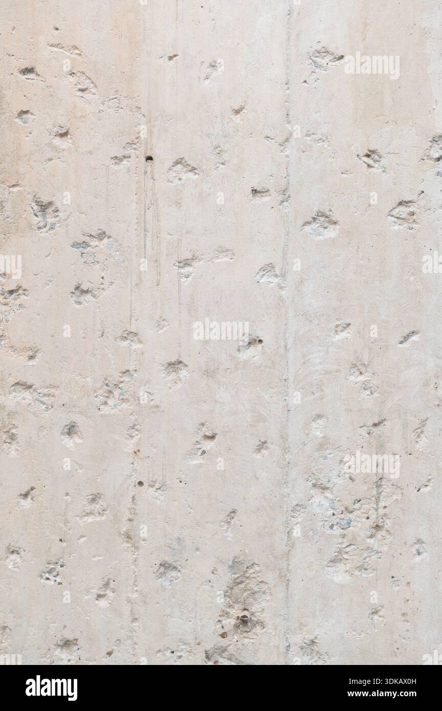 Rough concrete wall texture with natural surface imperfections Stock Photo