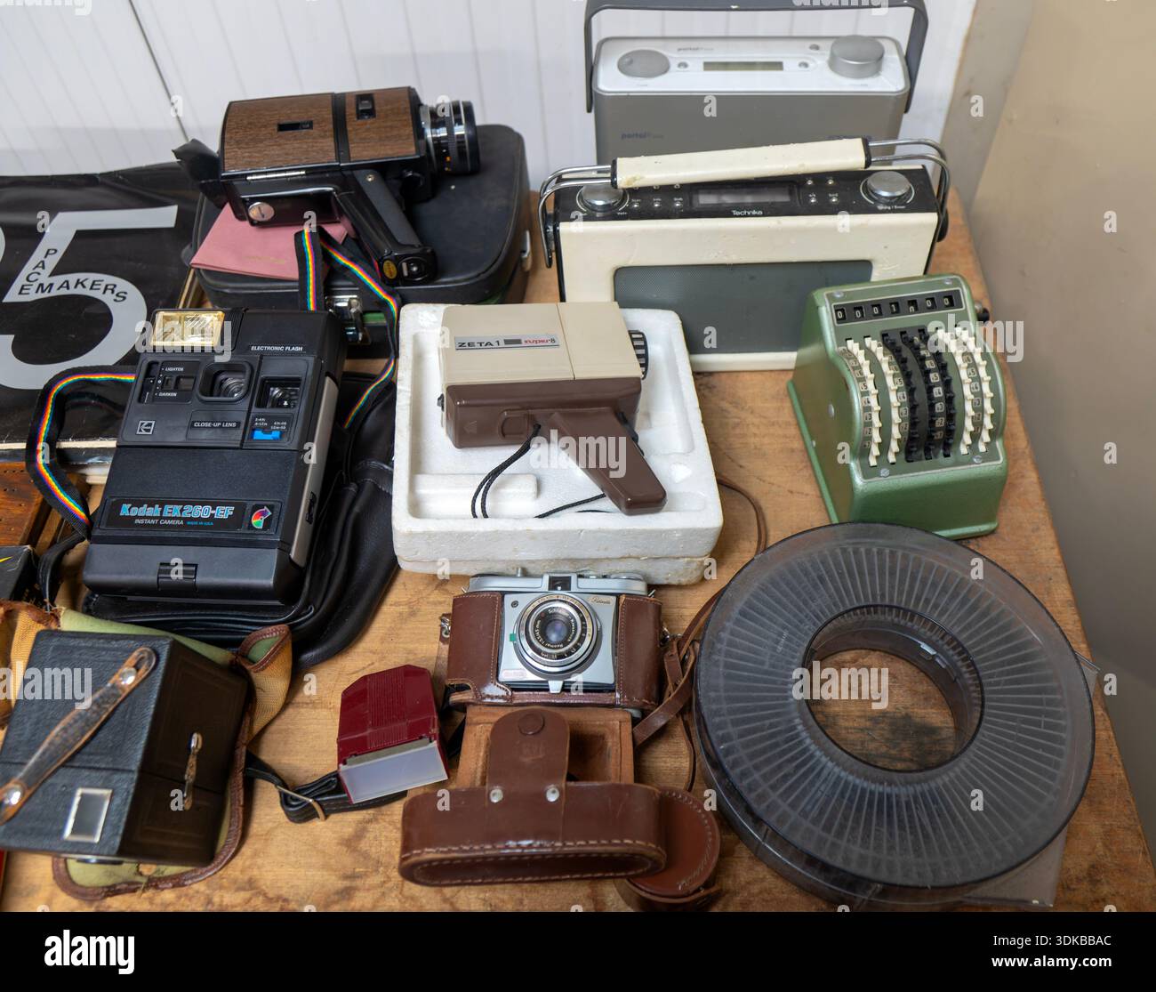 Display of film cameras, cine camera, transistor radios and other types of old analogue technology, UK Stock Photo