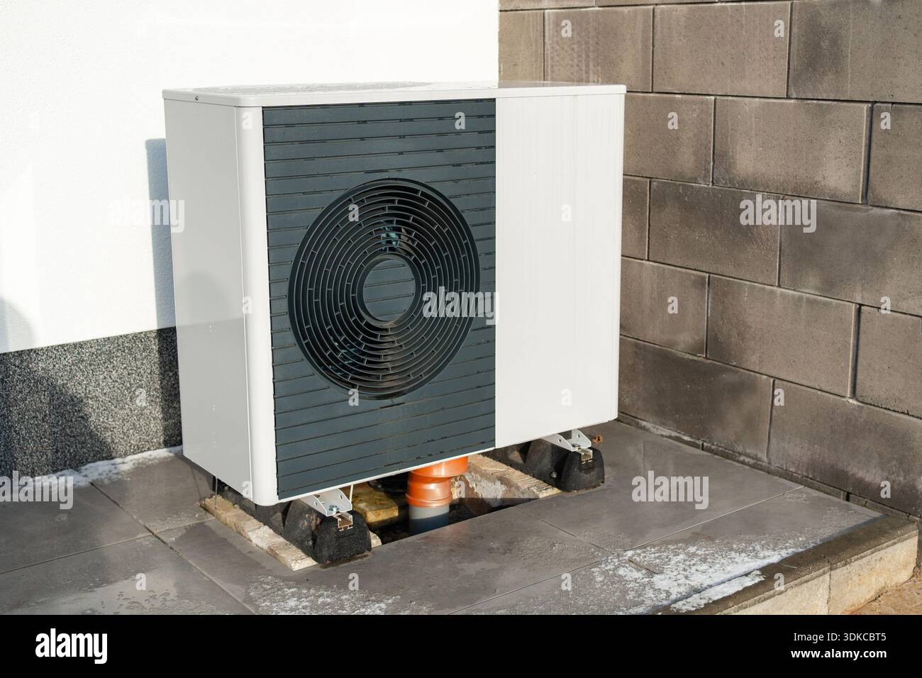 Outdoor heat pump or air conditioning unit installed on residential ...