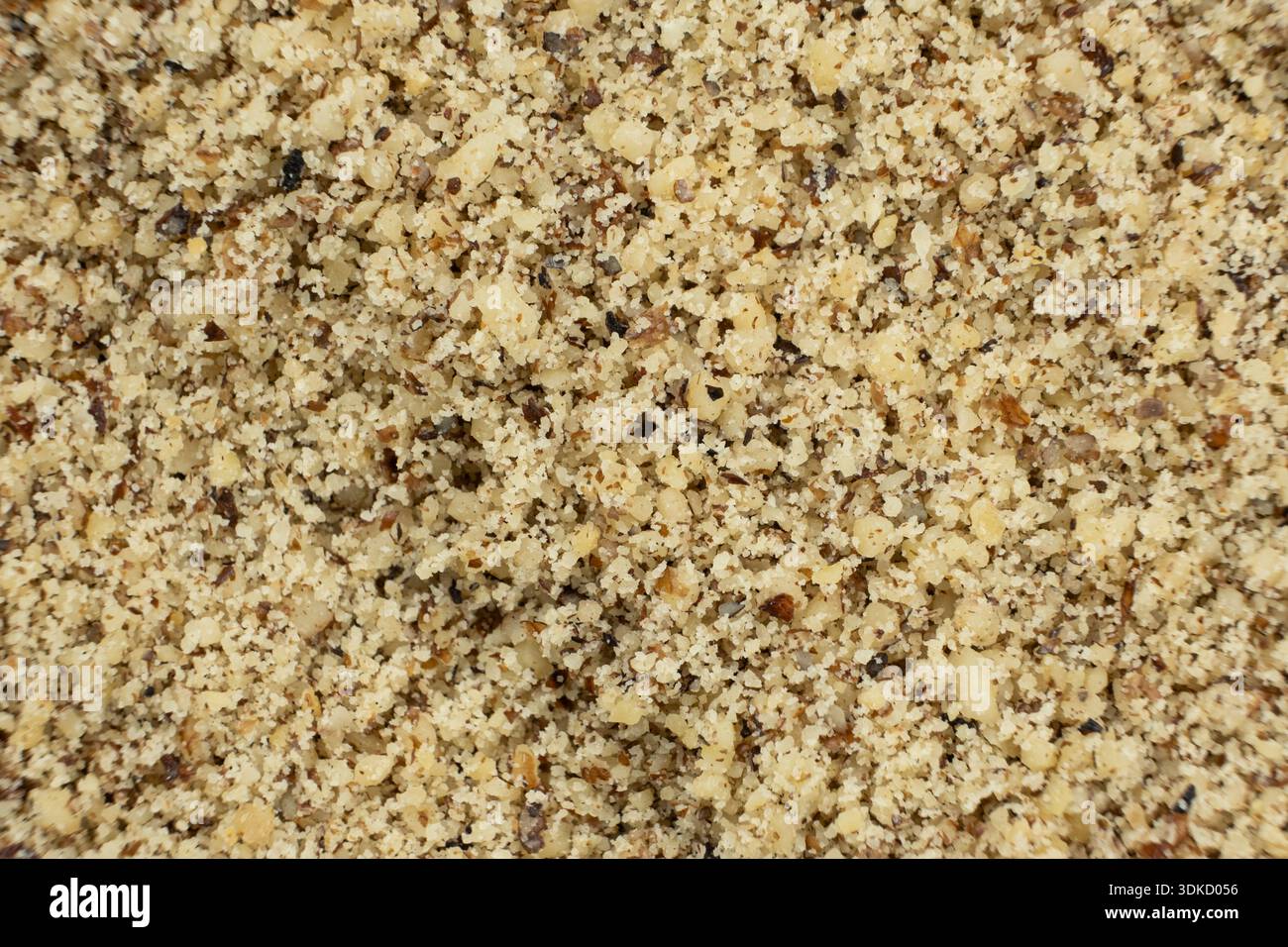 Macro crushed walnut kernels top view. Stock Photo