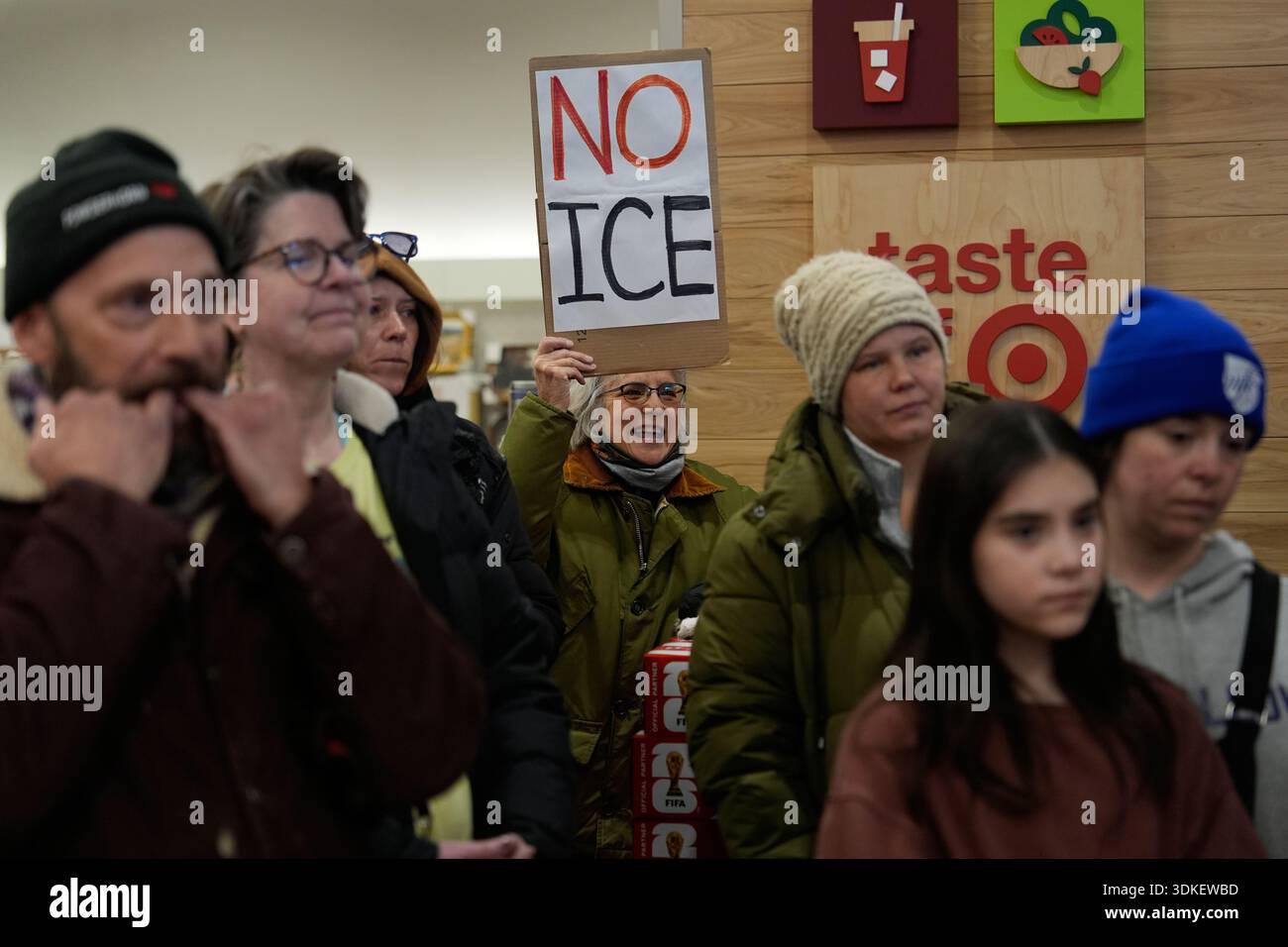 People gather during a protest at a Target store on Saturday, Jan. 31 ...