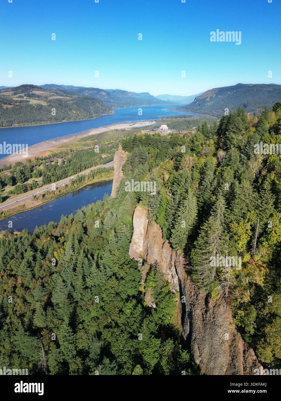Daytime blue sky view of the historic Vista House at Crown Point in the Columbia River Gorge of Oregon Stock Photo
