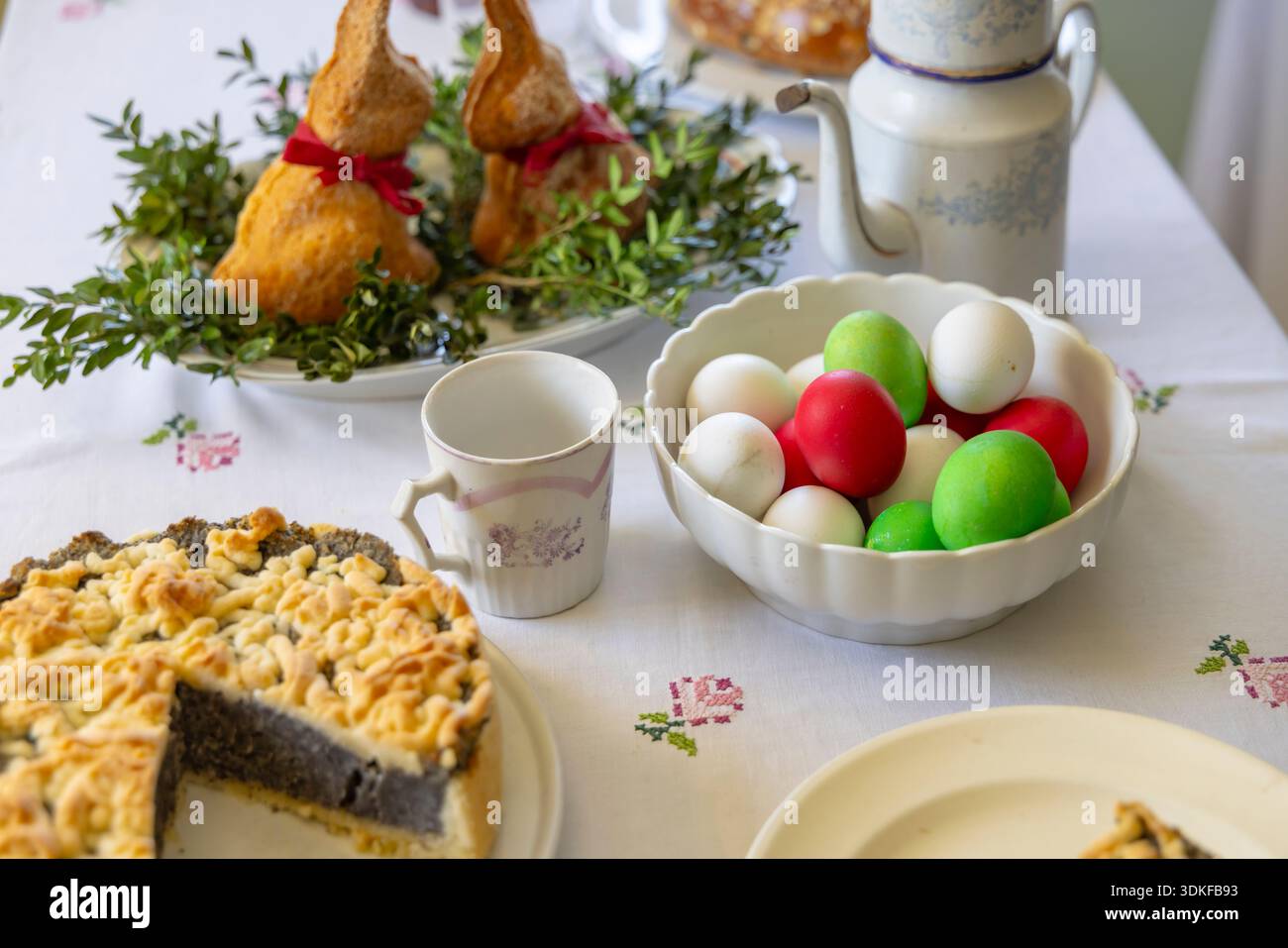Traditional Czech Easter table presenting various holiday sweets and colored eggs Stock Photo