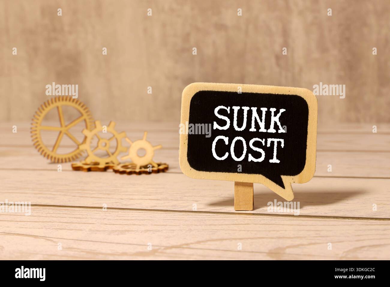 Sunk Cost is shown using a text. Stock Photo