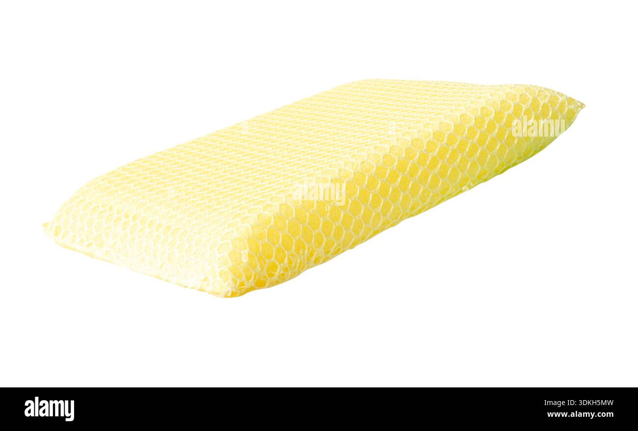 A yellow dish sponge is isolated on white background with clipping path. Stock Photo