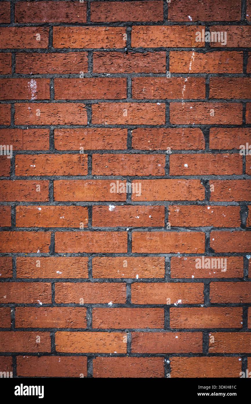 Vertical pattern of a red bricks wall Stock Photo
