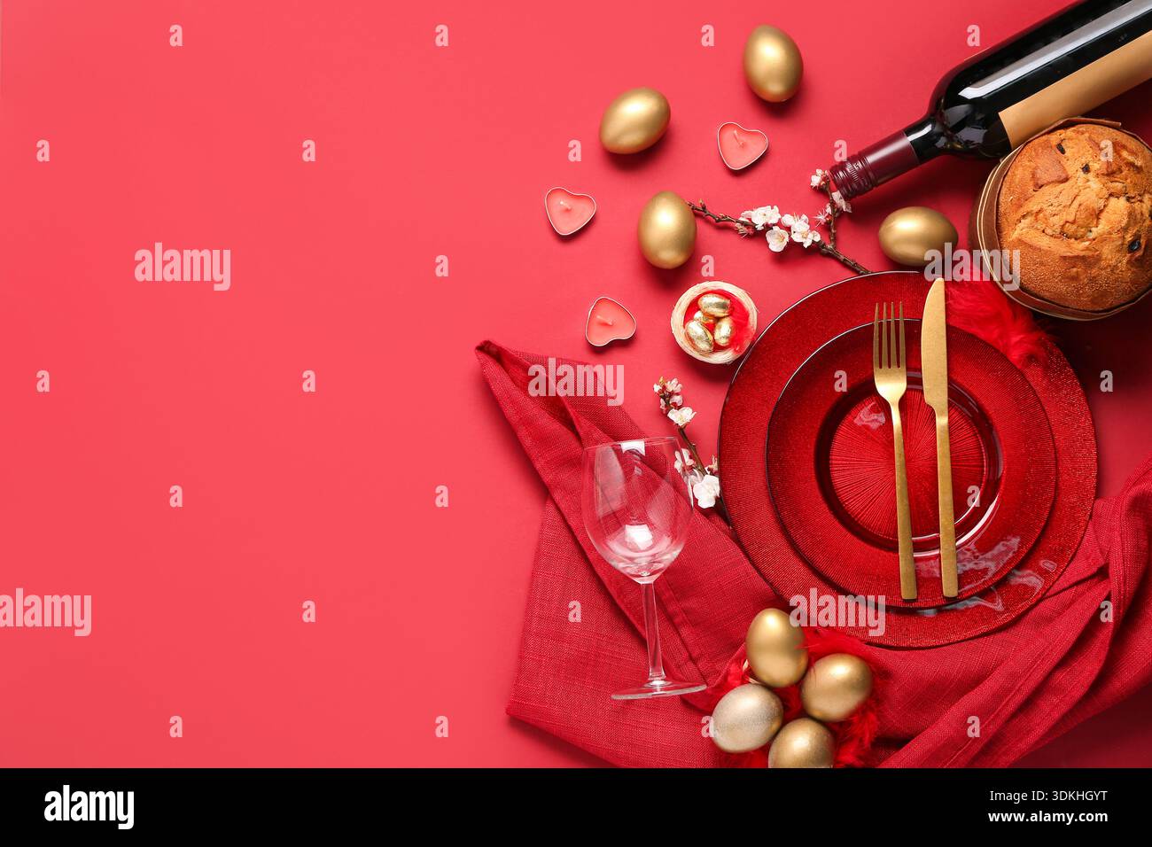 Beautiful table setting with Easter eggs on red background Stock Photo