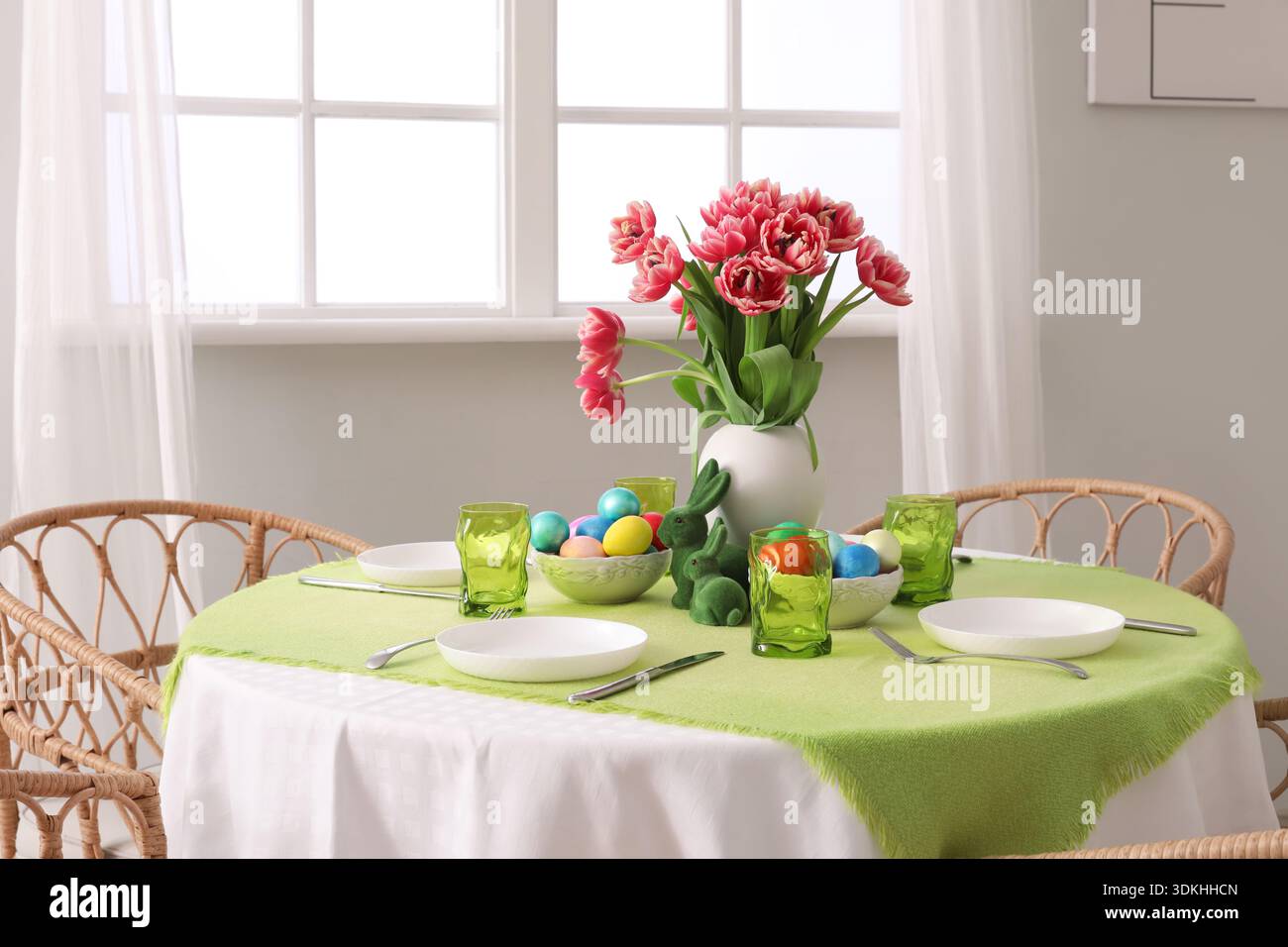 Beautiful table serving for Easter celebration in light dining room Stock Photo