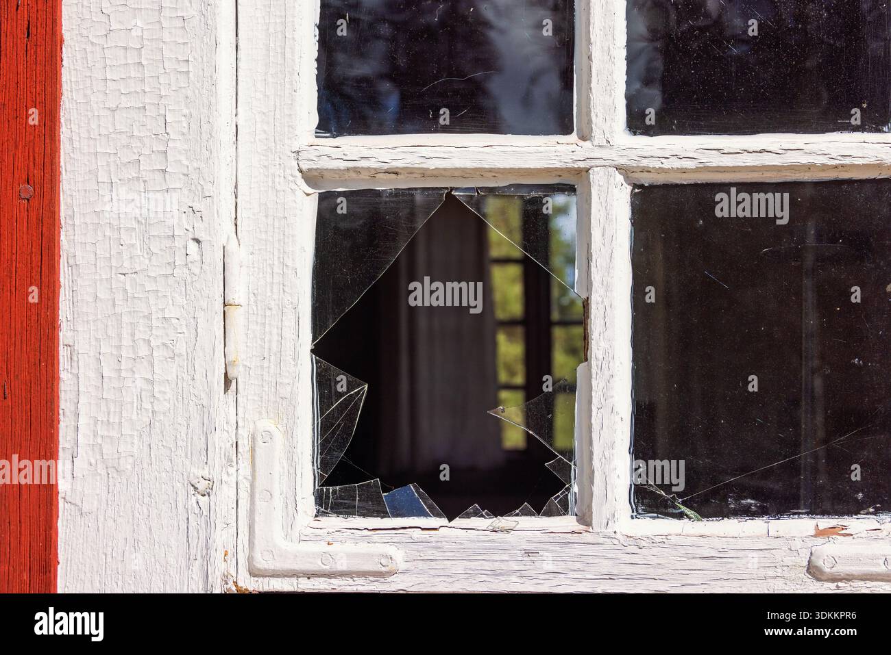 Broken glass window on a cottage Stock Photo