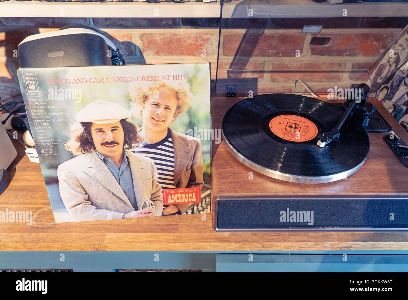 Simon and Garfunkel 1972 compilation Greatest Hits 12-inch LP vinyl record playing on a record player with the album cover art. UK Stock Photo