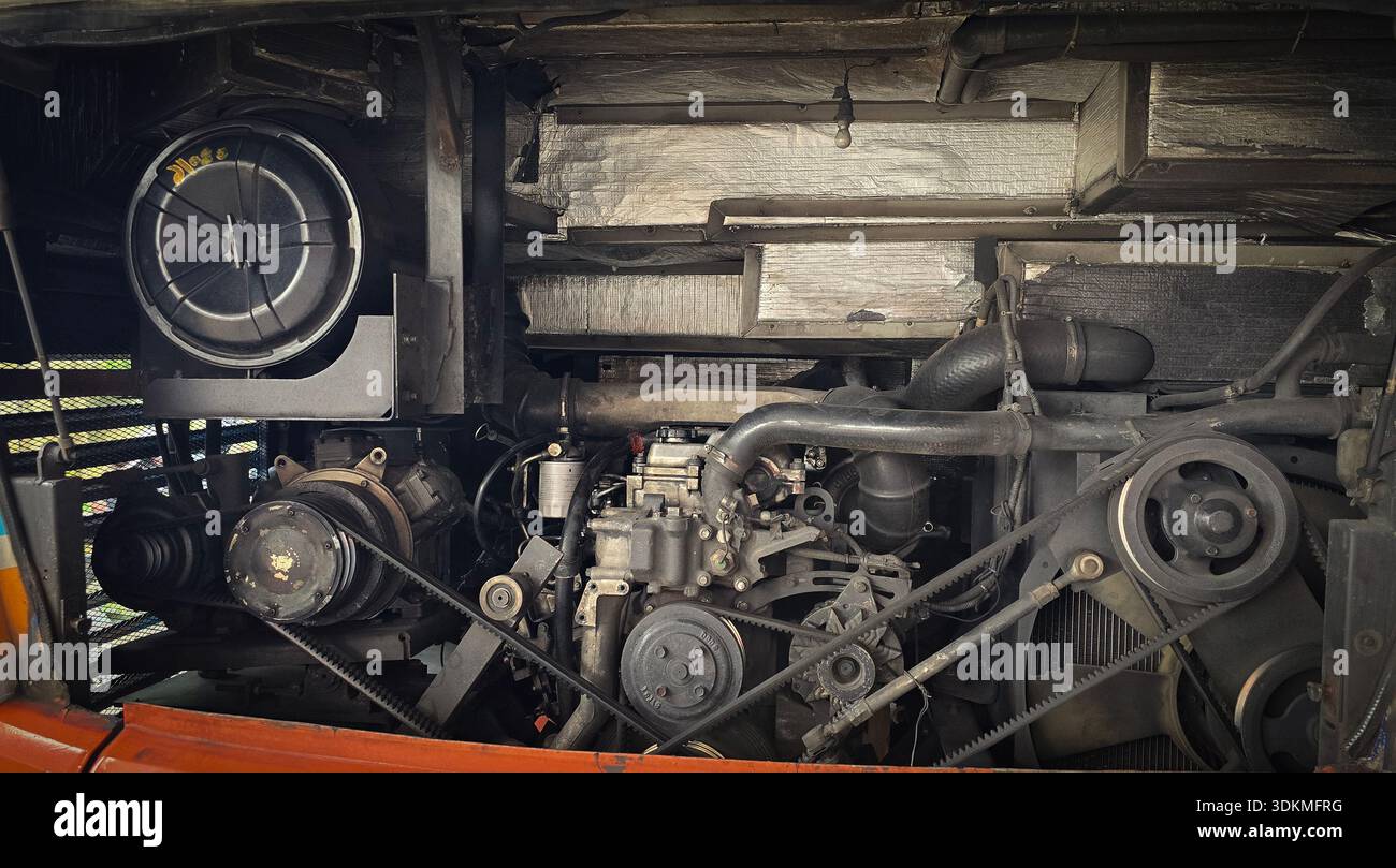 detailed view of a double decker bus engine bay showing belts, pulleys ...