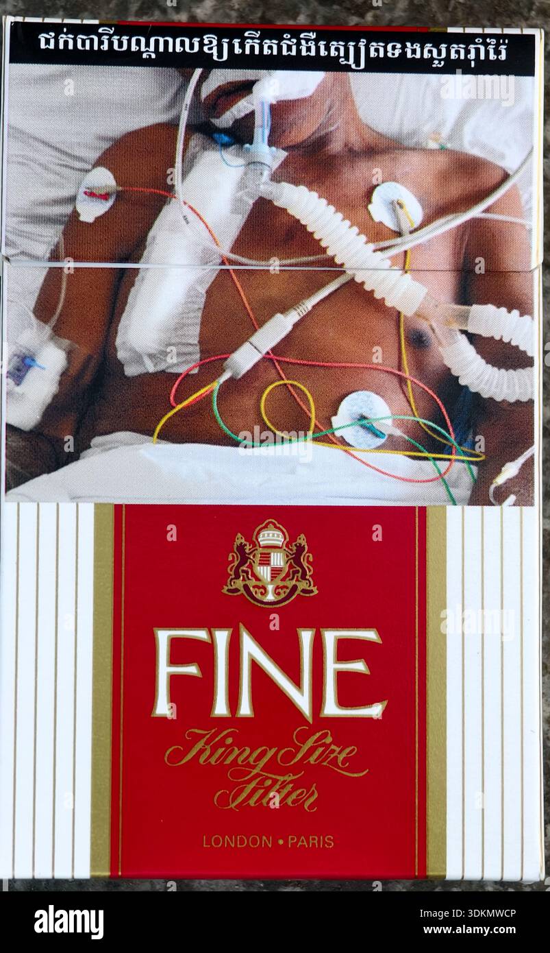 fine cigarette FINE King Size Filter cigarettes sold in Cambodia. The top of the package  features a graphic health warning required by Cambodian law, showing a  person in an intensive care setting on life