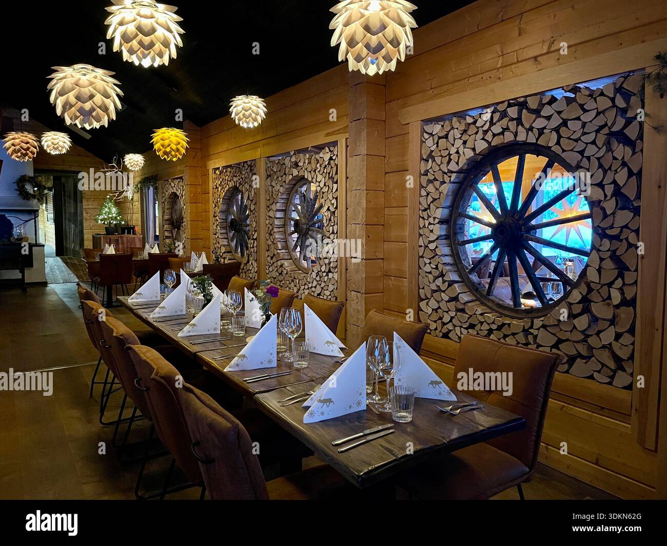 The warmly decorated interior of the restaurant in the Apukka Resort, Rovaniemi, Finland Stock Photo