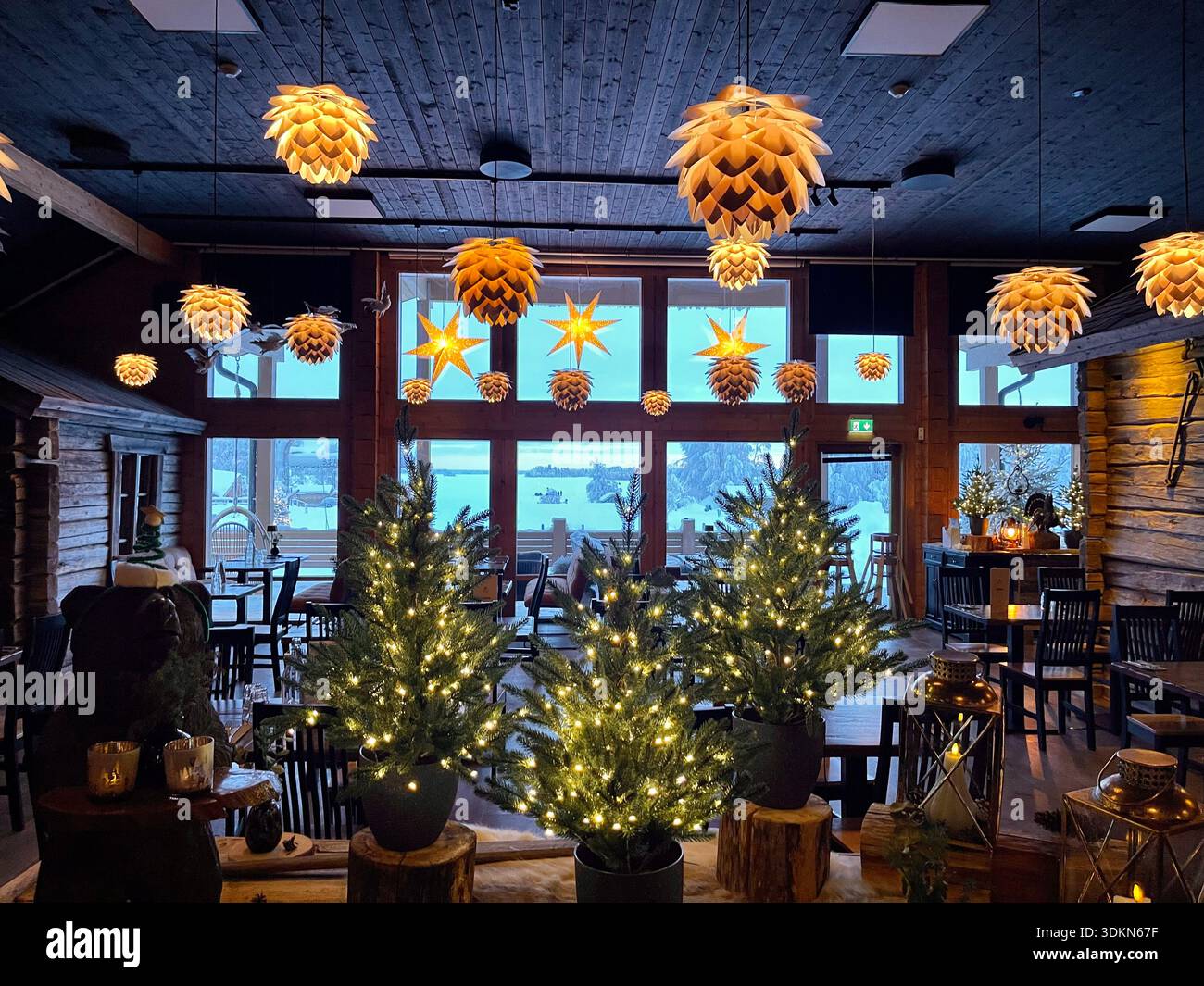 The warmly decorated interior of the restaurant in the Apukka Resort, Rovaniemi, Finland Stock Photo