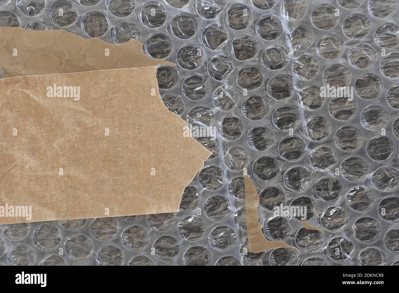 Bubble wrap plastic and adhesive tape background texture with copyspace. Stock Photo