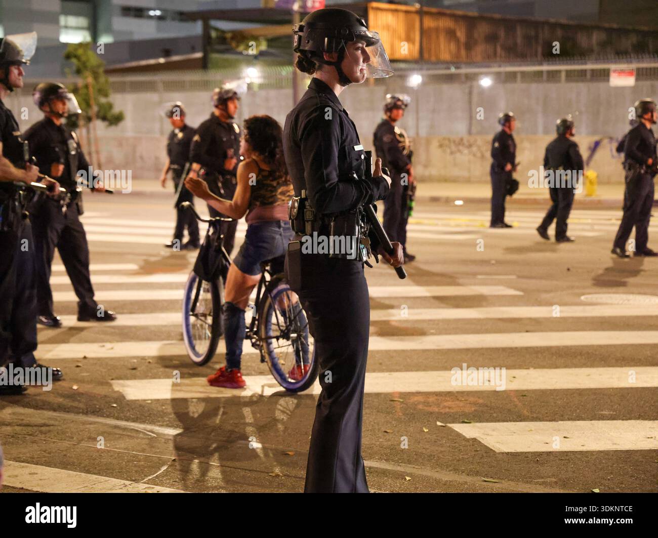 Los Angeles, Ca, USA. 31st Jan, 2026. A female police officer stands ...