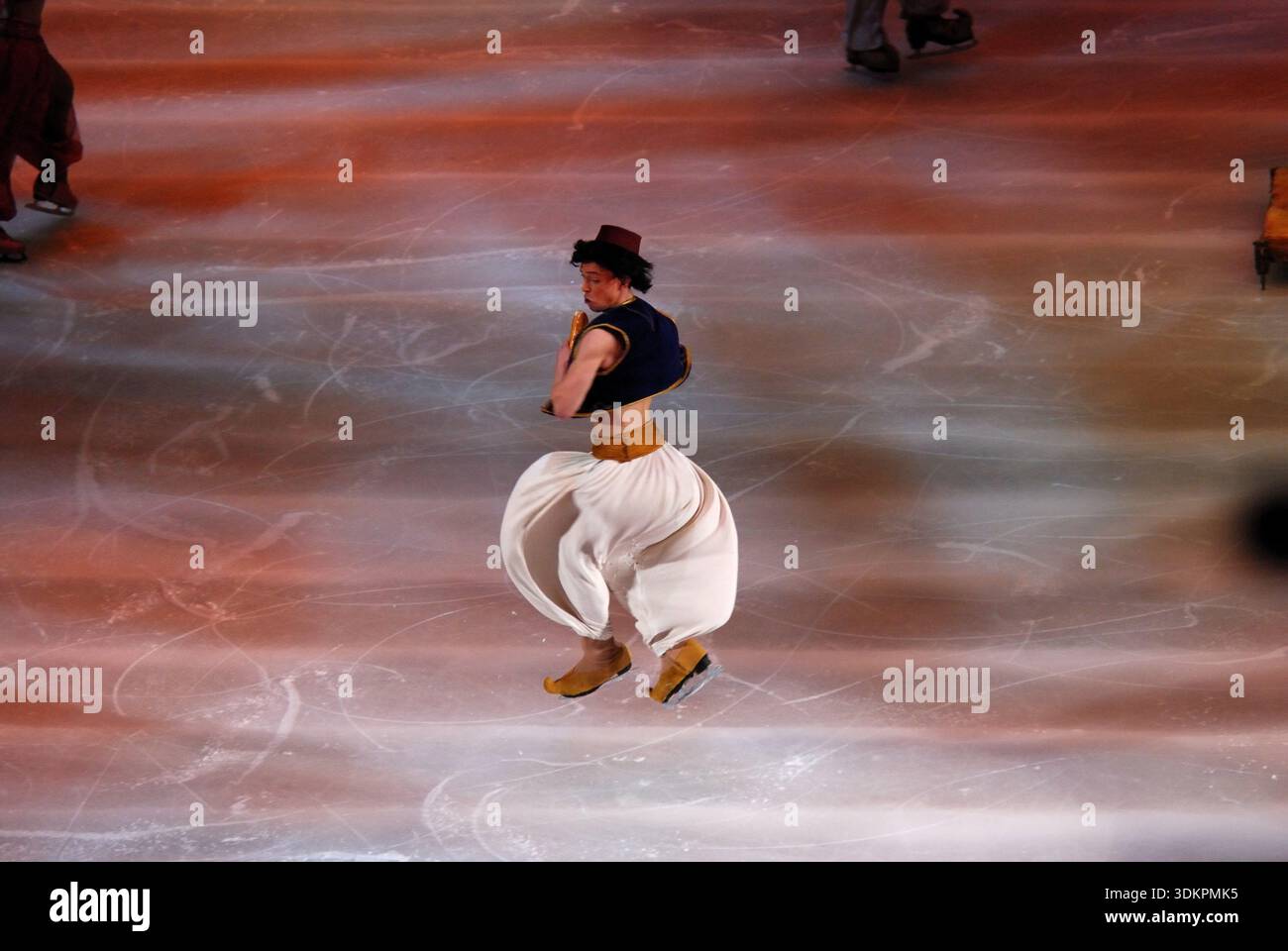 Aladdin spinning on an ice stage during performance in Geneva, Switzerland Stock Photo