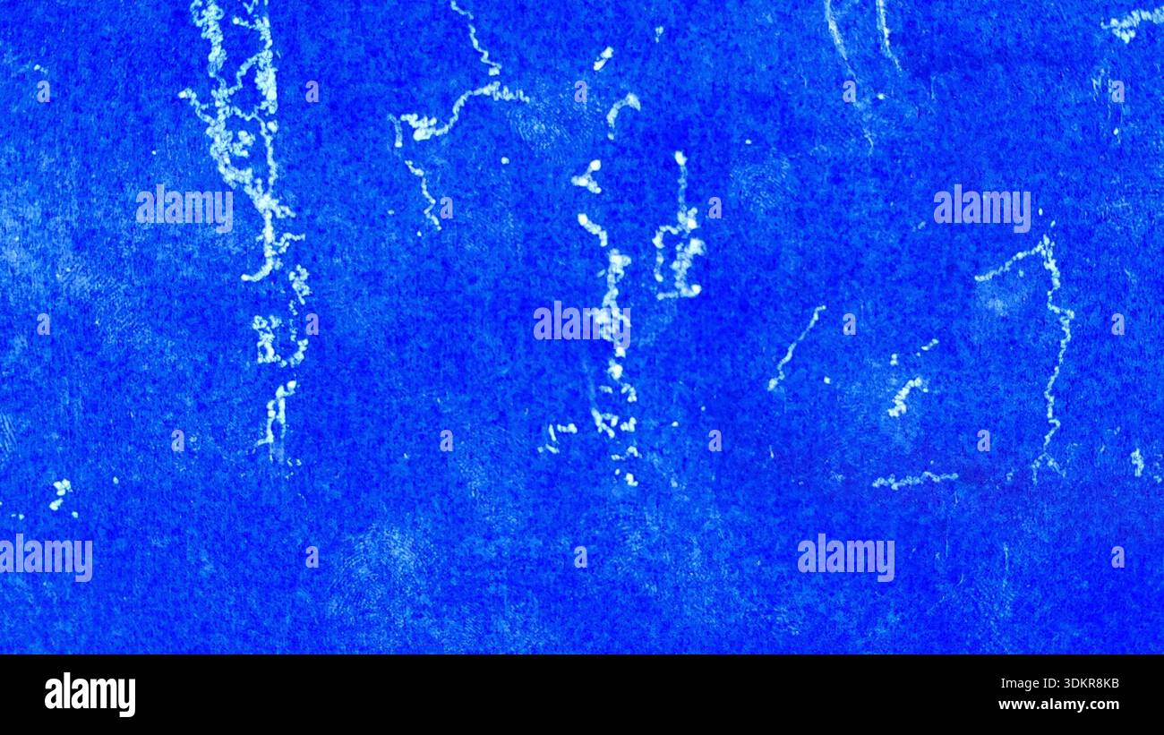 Distressed Royal Blue Construction Paper Surface with White Paint Splatter and Grungy Artistic Weathered Texture Stock Photo