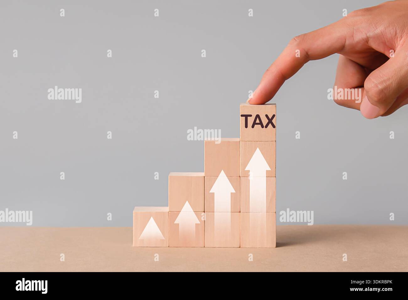 Tax Blocks The concept of tax filing season, wooden blocks and tax symbols on tax ...