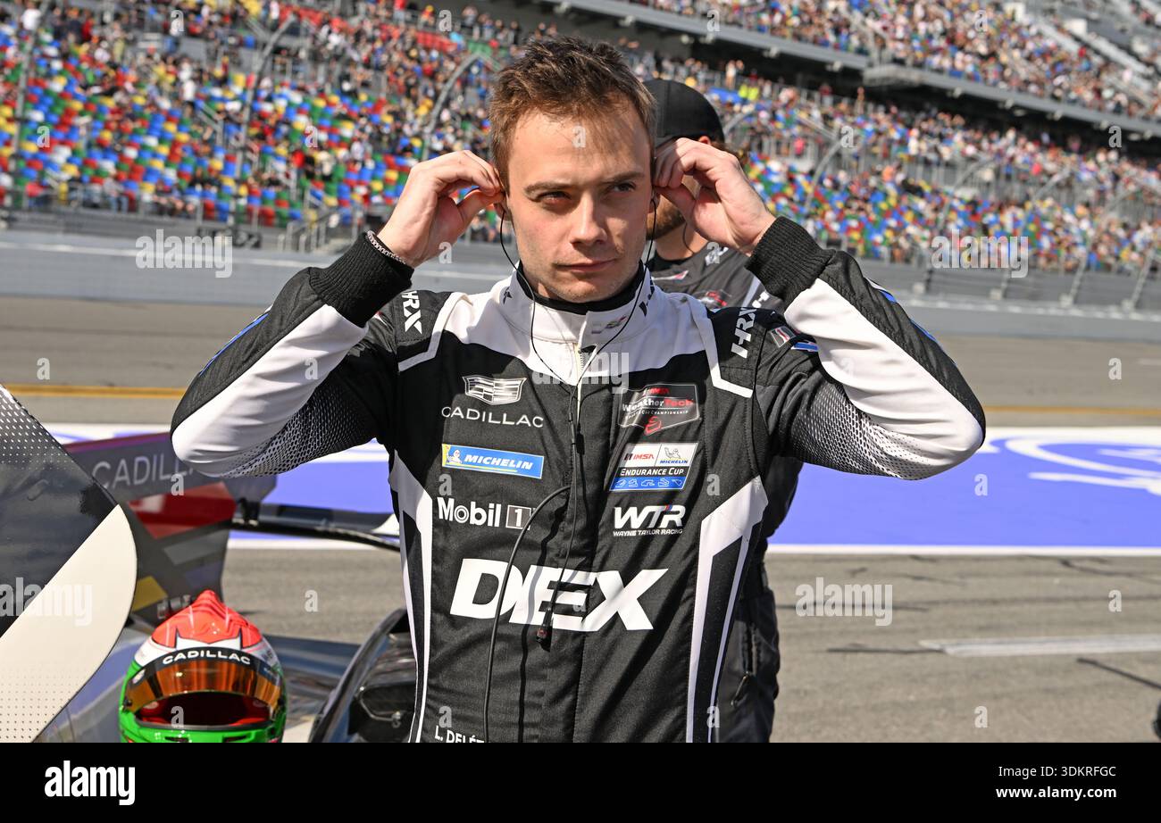 Dex Racing Driver Louis Deletraz prepares his radio ear pieces before he climbs ...