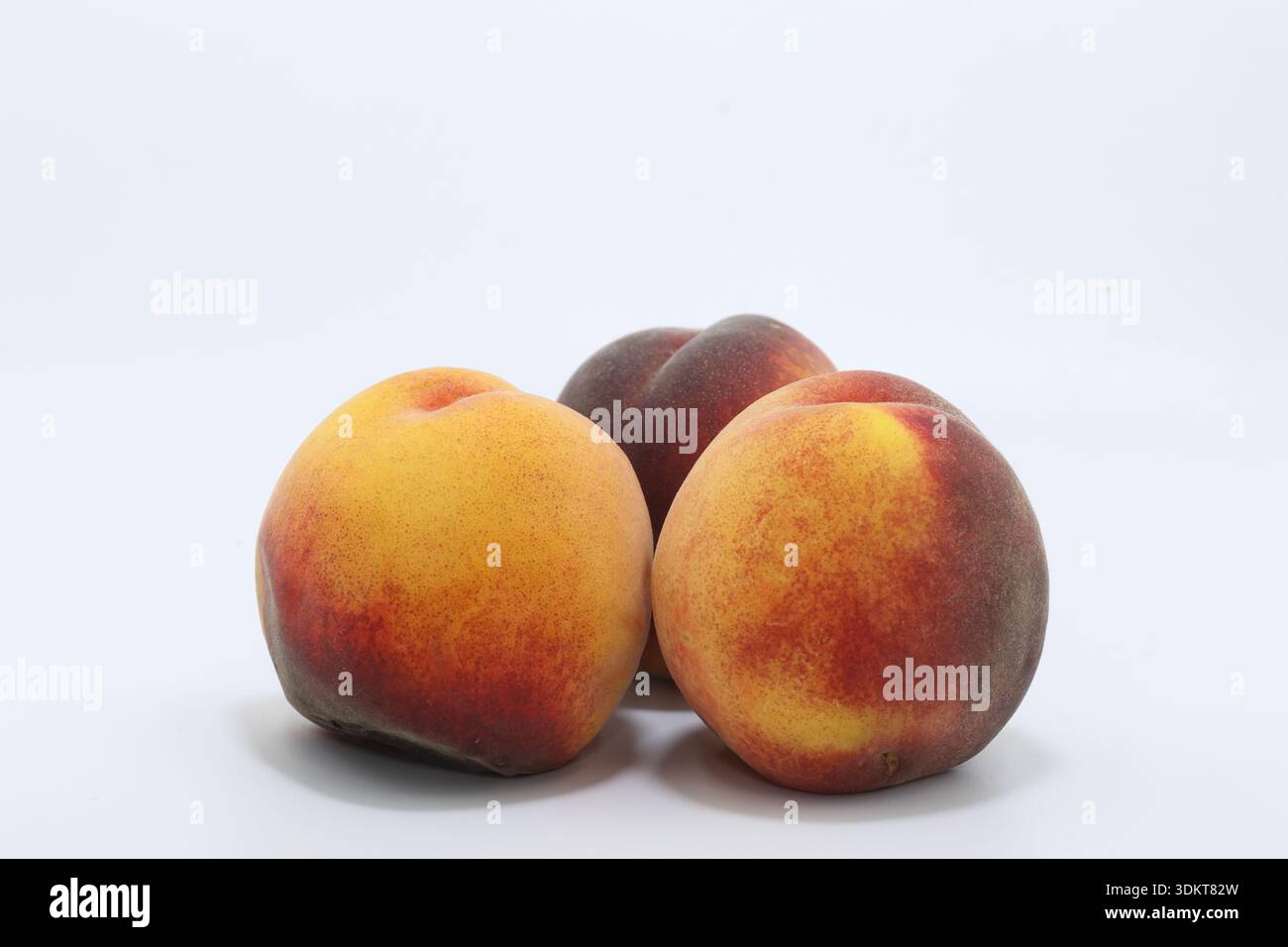 ripe peaches isolated on white Stock Photo