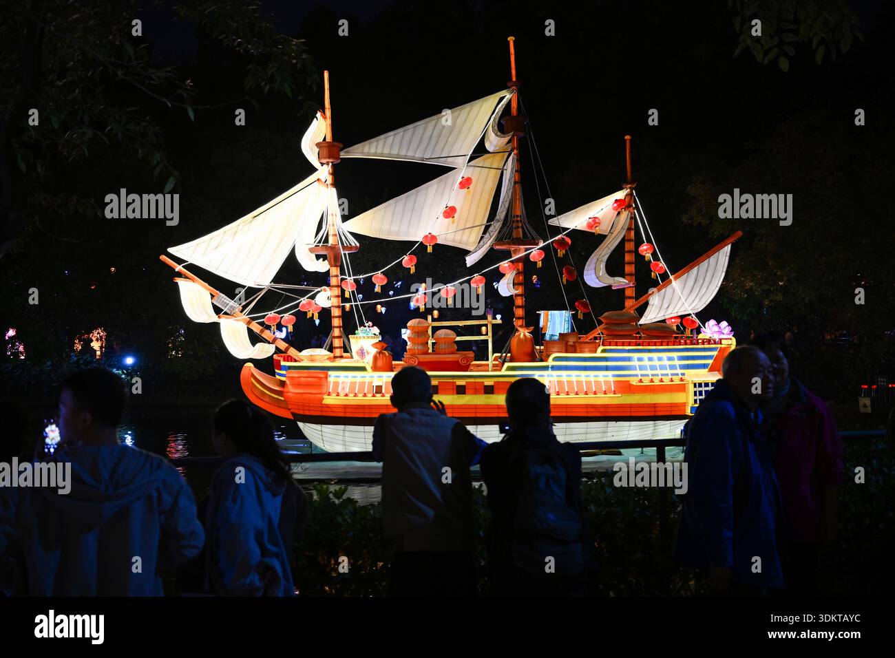Visitors admire lantersn at the Spring Festival Lantern Show in Yuexiu ...