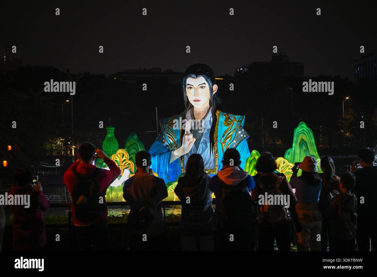Visitors admire lantersn at the Spring Festival Lantern Show in Yuexiu ...